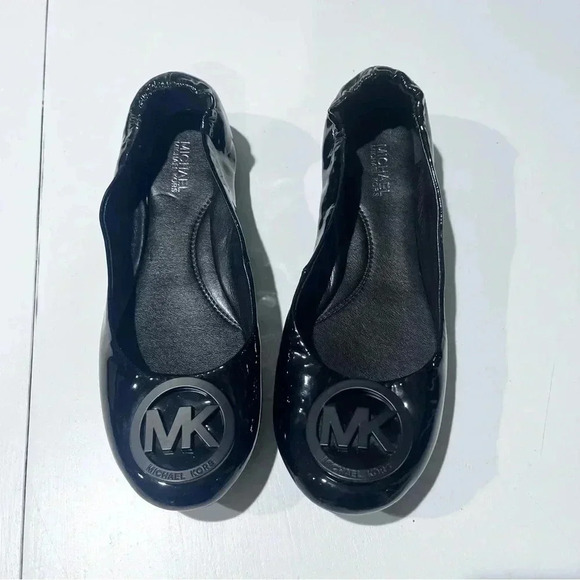 Michael Kors Shoes - Michael kors MK patent leather  black slip‎ on flats front logo womens size 6.5